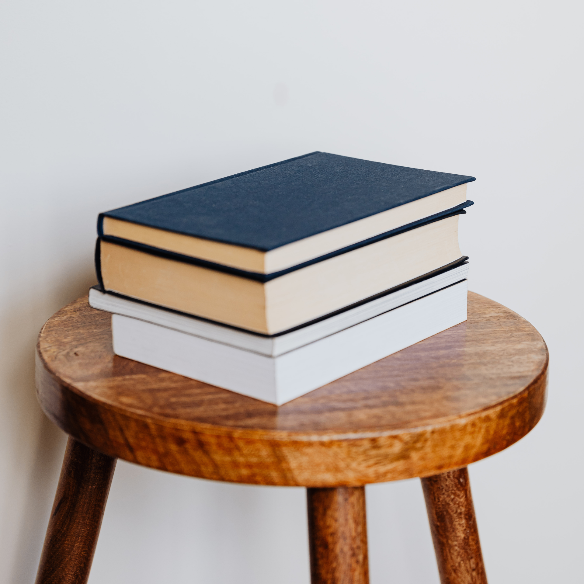 Student writing in a notebook while studying